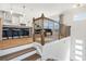 Open-concept living space with hardwood floors, a wooden stairway, and abundant natural light at 1105 Rivard Nw Cir, Atlanta, GA 30318