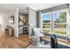 Well-lit home office with desk, chair, and large windows offering a view of the neighborhood at 1105 Rivard Nw Cir, Atlanta, GA 30318
