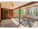 Covered back patio with a garden, offering an outdoor living space at 1603 Circlestone Dr, Stone Mountain, GA 30088