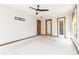 Bedroom with a ceiling fan, natural light, and access to storage or closet space at 1603 Circlestone Dr, Stone Mountain, GA 30088