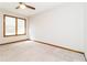 Spacious bedroom with neutral carpet, ample natural light, and a ceiling fan at 1603 Circlestone Dr, Stone Mountain, GA 30088