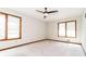 Bright, spacious bedroom featuring neutral carpet, a ceiling fan, and natural light from multiple windows at 1603 Circlestone Dr, Stone Mountain, GA 30088