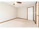 Bedroom with neutral carpet, a ceiling fan, natural light, and a closet door at 1603 Circlestone Dr, Stone Mountain, GA 30088