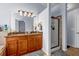 Bathroom features a granite countertop, a large mirror, and a stand up shower at 1829 Appaloosa Mill Ct, Buford, GA 30519