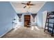 Carpeted bedroom offering light blue walls, a ceiling fan, and a study/desk area at 1829 Appaloosa Mill Ct, Buford, GA 30519