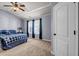Bedroom with light gray walls, carpeted floor, and a queen-size bed at 1829 Appaloosa Mill Ct, Buford, GA 30519