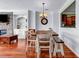 Dining area with wooden table, chairs, chandelier and a view into the kitchen at 1829 Appaloosa Mill Ct, Buford, GA 30519