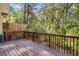 Spacious wooden back deck with scenic views of the surrounding nature at 2864 Parkway Close, Lithonia, GA 30058