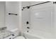 Bright bathroom showcasing a tub with shower and modern fixtures at 2864 Parkway Close, Lithonia, GA 30058