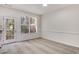Bright dining area with carpeted floor, a large window, and access to an outdoor deck at 2864 Parkway Close, Lithonia, GA 30058