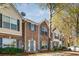 Brick facade townhome features a lovely blue door and trimmed windows at 2864 Parkway Close, Lithonia, GA 30058