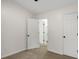 Clean hallway with multiple doorways at 2864 Parkway Close, Lithonia, GA 30058