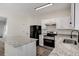 Modern kitchen featuring stainless steel appliances and granite countertops at 2864 Parkway Close, Lithonia, GA 30058