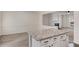 Stylish kitchen island with granite countertop and white cabinets at 2864 Parkway Close, Lithonia, GA 30058