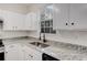 The kitchen shows bright countertops, modern finishes, and stainless steel sink at 2864 Parkway Close, Lithonia, GA 30058