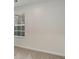 Neutral-toned wall with a window bringing natural light to the room at 2864 Parkway Close, Lithonia, GA 30058