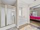 This bathroom boasts a separate walk-in shower and soaking tub next to the main bedroom at 1408 Seals Rd, Dallas, GA 30157