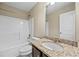 Bathroom featuring granite counters, a white tub and white cabinets at 1408 Seals Rd, Dallas, GA 30157