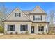 Charming two-story home with a welcoming front porch and classic architectural details at 1408 Seals Rd, Dallas, GA 30157
