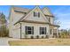 Attractive two-story home with a side-entry garage and professionally landscaped yard at 1408 Seals Rd, Dallas, GA 30157