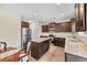 Modern kitchen featuring stainless steel appliances, granite counters and dark wood cabinets at 1408 Seals Rd, Dallas, GA 30157