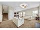 Open-concept living area with a view of the staircase and dining space at 1408 Seals Rd, Dallas, GA 30157