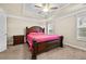 Main bedroom featuring a tray ceiling, tan walls and carpet at 1408 Seals Rd, Dallas, GA 30157