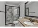 Bathroom features granite counters, tile shower, and modern fixtures at 2555 Stonevalley Ln, Cumming, GA 30041