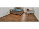 Bedroom features a cozy bed, wood floor, and neutral paint at 2555 Stonevalley Ln, Cumming, GA 30041