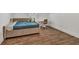 Bedroom features a cozy bed, wood floor, and neutral paint at 2555 Stonevalley Ln, Cumming, GA 30041