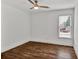 Bedroom features wood floors, window, and neutral paint at 2555 Stonevalley Ln, Cumming, GA 30041