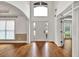 Bright entryway with hardwood floors and a large window above the front door at 2555 Stonevalley Ln, Cumming, GA 30041