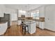 Modern kitchen with white cabinets, stainless steel appliances, and a granite island with seating at 2555 Stonevalley Ln, Cumming, GA 30041
