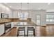 Modern kitchen with white cabinetry, granite countertops, and stainless steel appliances at 2555 Stonevalley Ln, Cumming, GA 30041