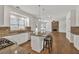 Open kitchen featuring a large island with seating, granite countertops, and stainless steel appliances at 2555 Stonevalley Ln, Cumming, GA 30041
