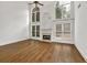 Grand living room with soaring ceilings, fireplace, hardwood floors and arched windows at 2555 Stonevalley Ln, Cumming, GA 30041