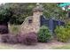 Stone gate entrance with lush landscaping welcomes you to the community at 2555 Stonevalley Ln, Cumming, GA 30041