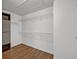 Walk-in closet with hardwood floors and wire shelving at 2555 Stonevalley Ln, Cumming, GA 30041