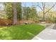 Lush backyard with manicured lawn and patio area is perfect for outdoor entertaining and relaxing at 2877 Elliott Ne Cir, Atlanta, GA 30305