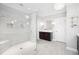Modern bathroom featuring a glass-enclosed shower, double vanity, and stylish lighting at 2877 Elliott Ne Cir, Atlanta, GA 30305