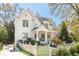 Beautiful white home with a welcoming porch, lovely landscaping, and classic white picket fence at 2877 Elliott Ne Cir, Atlanta, GA 30305