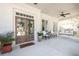Inviting front porch with double doors, cozy seating area, and a relaxing porch swing at 2877 Elliott Ne Cir, Atlanta, GA 30305