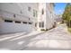 Spacious two-car garage with white brick and an extra-long driveway, offering ample parking at 2877 Elliott Ne Cir, Atlanta, GA 30305