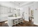 Modern kitchen with gray cabinets, stainless steel appliances, and center island with seating at 2877 Elliott Ne Cir, Atlanta, GA 30305