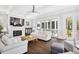 Bright living room with hardwood floors, fireplace, and sliding glass doors to outdoor patio at 2877 Elliott Ne Cir, Atlanta, GA 30305