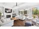Bright living room with hardwood floors, fireplace, and sliding glass doors to outdoor patio at 2877 Elliott Ne Cir, Atlanta, GA 30305