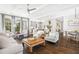Open-concept living space featuring hardwood floors, ample seating, and a view of the kitchen at 2877 Elliott Ne Cir, Atlanta, GA 30305