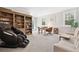 Living room with hardwood floors, bookshelf, sitting chair, and a comfortable massage chair at 2877 Elliott Ne Cir, Atlanta, GA 30305