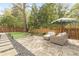 Stone patio with comfortable seating, lush landscaping, and a serene backyard setting at 2877 Elliott Ne Cir, Atlanta, GA 30305