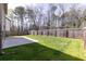 Large backyard with a patio and wood fence at 3894 Dunaire Dr, Stone Mountain, GA 30083